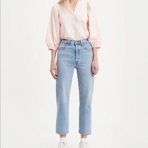 Rib cage crop flare Levi jeans.